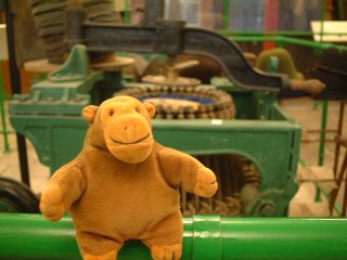 Mr Monkey beside a hat blocking machine