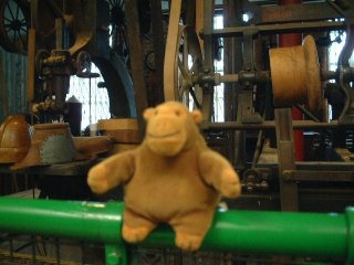 Mr Monkey in front of a block copying machine