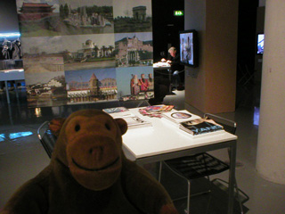 Mr Monkey in front of a table of books about modern China