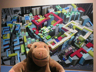 Mr Monkey looking at an architectural drawing