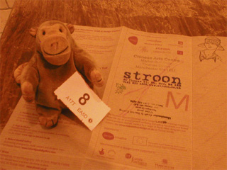 Mr Monkey with his raffle ticket and sheet of stamps