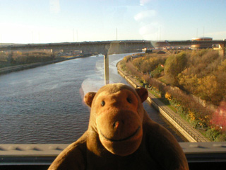 Mr Monkey looking at the Tyne from the train