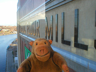 Mr Monkey looking at the outside of BALTIC