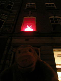 Mr Monkey looking at a vampire rabbit in a window