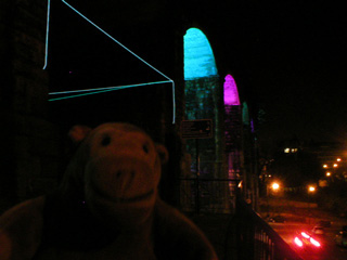 Mr Monkey looking at illuminated railway arches