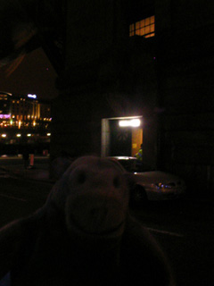 Mr Monkey approaching a door at the base of the Tyne Bridge
