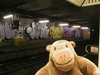 Mr Monkey looking at Spank the Monkey art at Jesmond Metro station