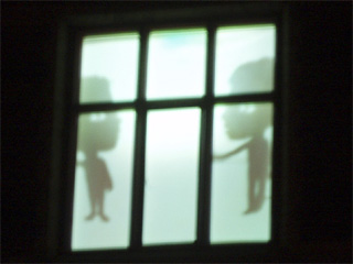 A pair of shadow puppets in a window of Saltwell Towers