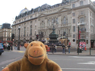 Mr Monkey looking across Piccadilly Circus