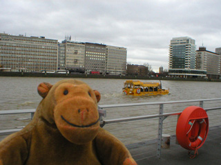 Mr Monkey watching a DUKW pass the Millbank pier