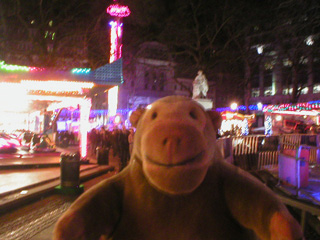 Mr Monkey looking at the Christmas fairground in Leicester Square