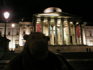 Mr Monkey looking at the National Gallery in the dark