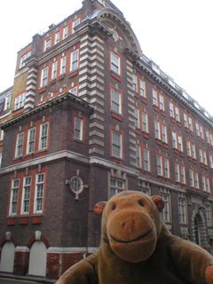 Mr Monkey looking at the corner of Great Scotland Yard