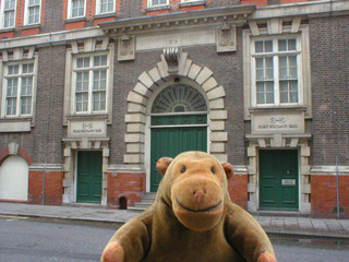 Mr Monkey looking at the door of Great Scotland Yard