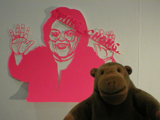 Mr Monkey looking at a cutout of Rosie O'Donnell