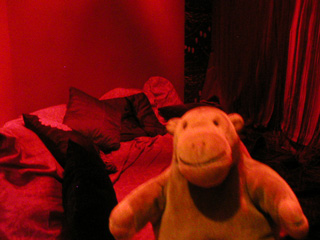 Mr Monkey looking at Karen Tam's completed opium den
