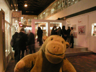 Mr Monkey watching the crowd looking at the Raw exhibition