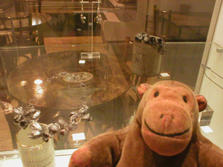 Mr Monkey looking at jewelry by Beth Hughes