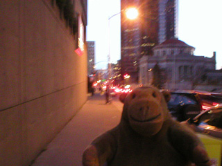 Mr Monkey scampering along 5th Avenue at dusk