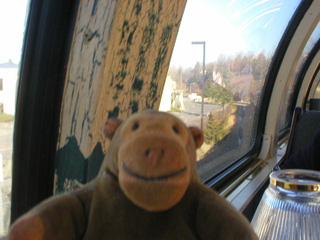 Mr Monkey looking out of the window going through Renton