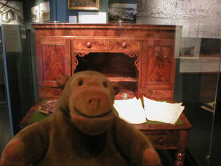 Mr Monkey examining Governor Stevens' desk