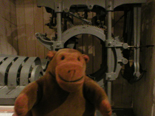 Mr Monkey examining an Iron Chink machine