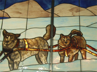 A pair of stained glass dogs