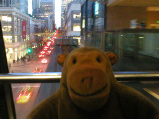 Mr Monkey riding the monorail through Seattle