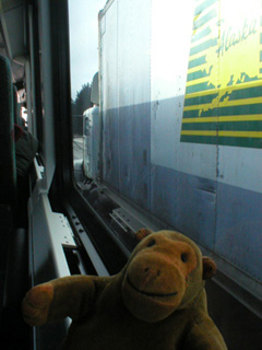 Mr Monkey looking at a truck on Interstate 5