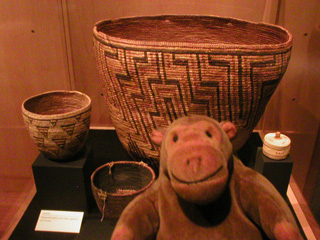 Mr Monkey looking at some baskets