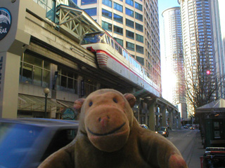 Mr Monkey looking up at the monorail at the Westlake Center