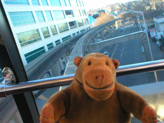 Mr Monkey on the monorail turning onto 5 Avenue North