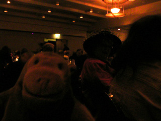 Mr Monkey checking out hats at the Gala Dinner