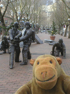 Mr Monkey looking at the Seattle Fallen Firefighters Memorial