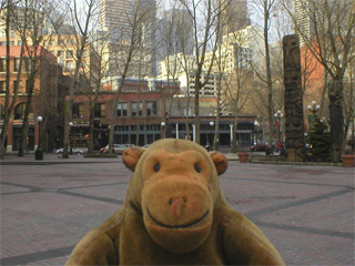 Mr Monkey looking at totem poles in Occidental Park