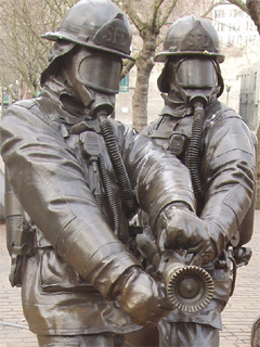 Two firefighters from the Seattle Fallen Firefighters Memorial