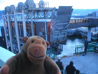 Mr Monkey watching the passenger drawbridge being lowered