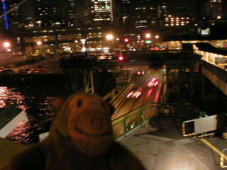 Mr Monkey watching cars driving off the ferry
