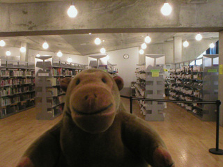 Mr Monkey looking at the foreign language stacks