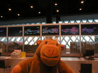 Mr Monkey looking at George Legrady's electronic installation displaying Keyword Map Attack
