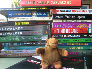 Mr Monkey examining the books he got from Seattle