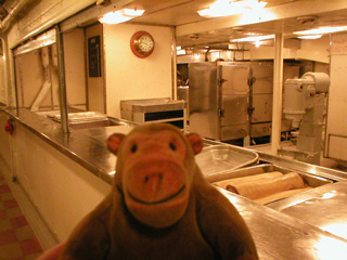 Mr Monkey waiting at the galley's serving hatch