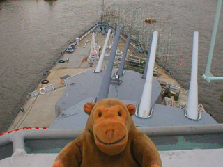 Mr Monkey looking down at the forward turrets of HMS Belfast