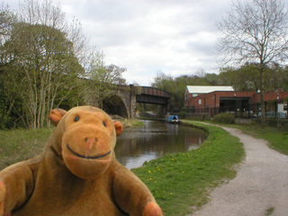 Mr Monkey looking at the viaduct crossing the canal