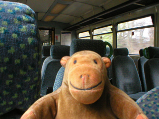 Mr Monkey in the train from Marple to Manchester