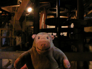 Mr Monkey looking at the mill machinery