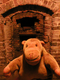 Mr Monkey looking at the entrance to the drying kiln basement