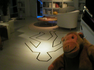 Mr Monkey looking at a fictional crime scene