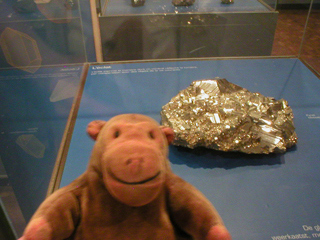 Mr Monkey at an enormous lump of iron pyrites