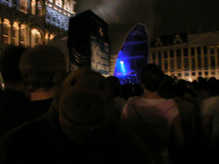 Mr Monkey looking at a large stage in the Grand Place